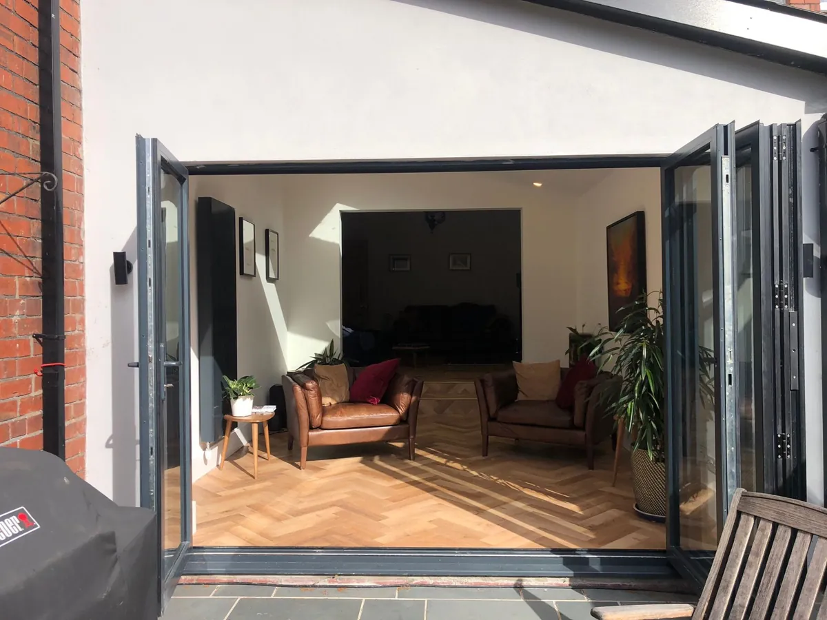 A finished rear extension in Roath, Cardiff, with bifold doors and herringbone floor